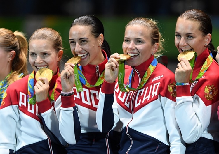 olympians bite their medals