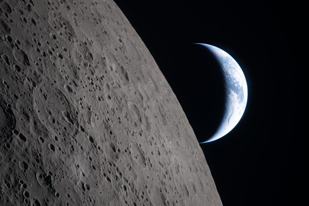 Earth setting behind the lunar limb during Artemis II flyby