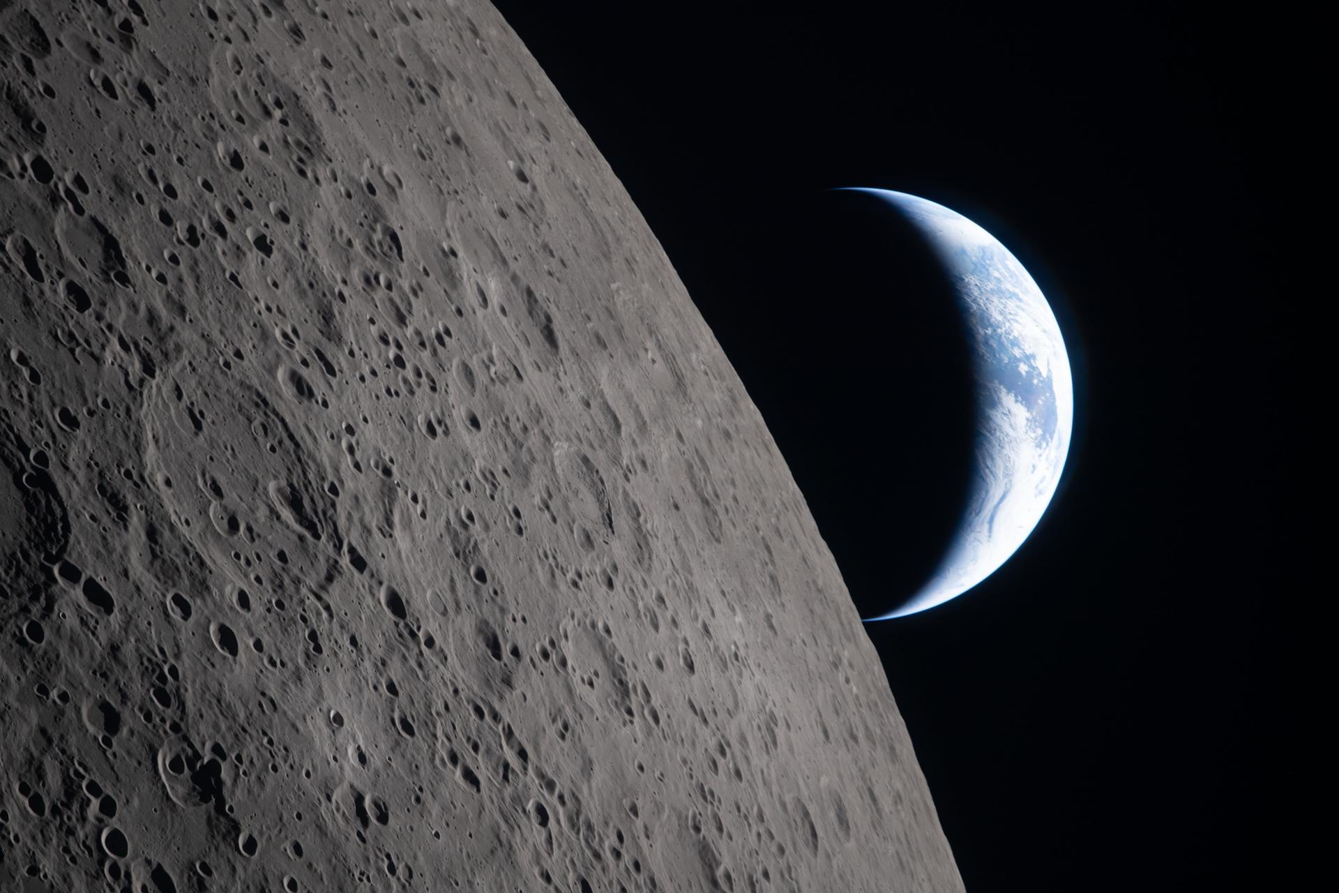 Earth setting behind the lunar limb during Artemis II flyby