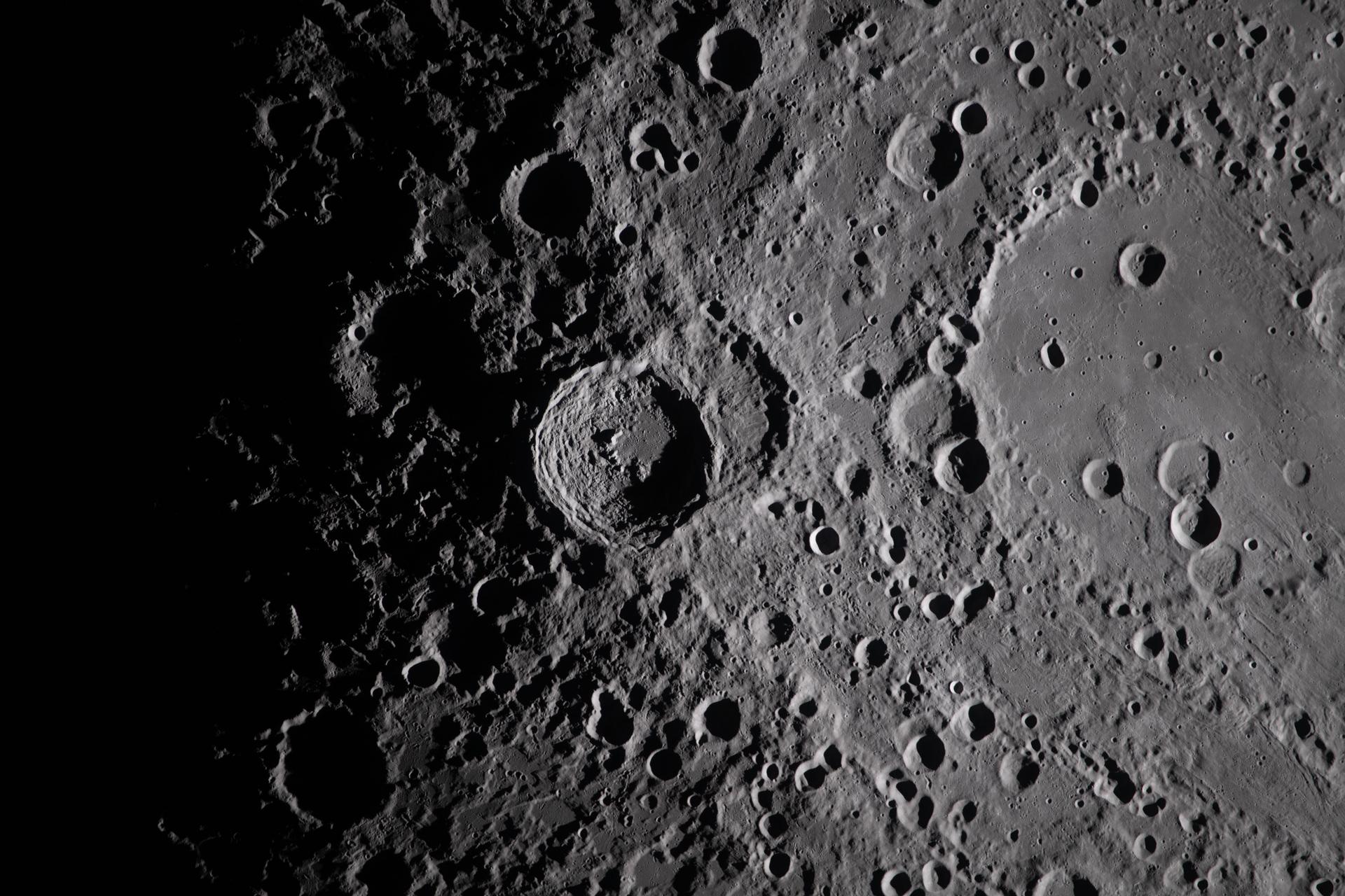 Lunar surface detail including crater shadows from Artemis II